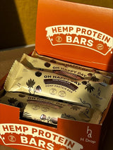 Oh Happy Day - kanepi proteiinibatoonid kookose ja macaga tumedas šokolaadis (12 tk. karp) H Drop Lietuva